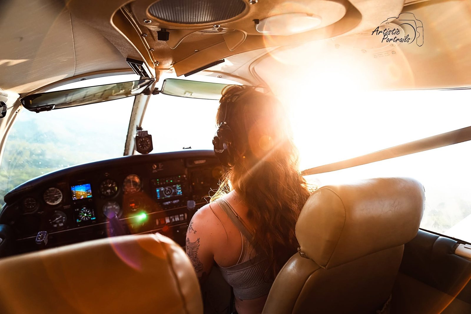 Rachel McFarland flying from the cockpit during sunset
