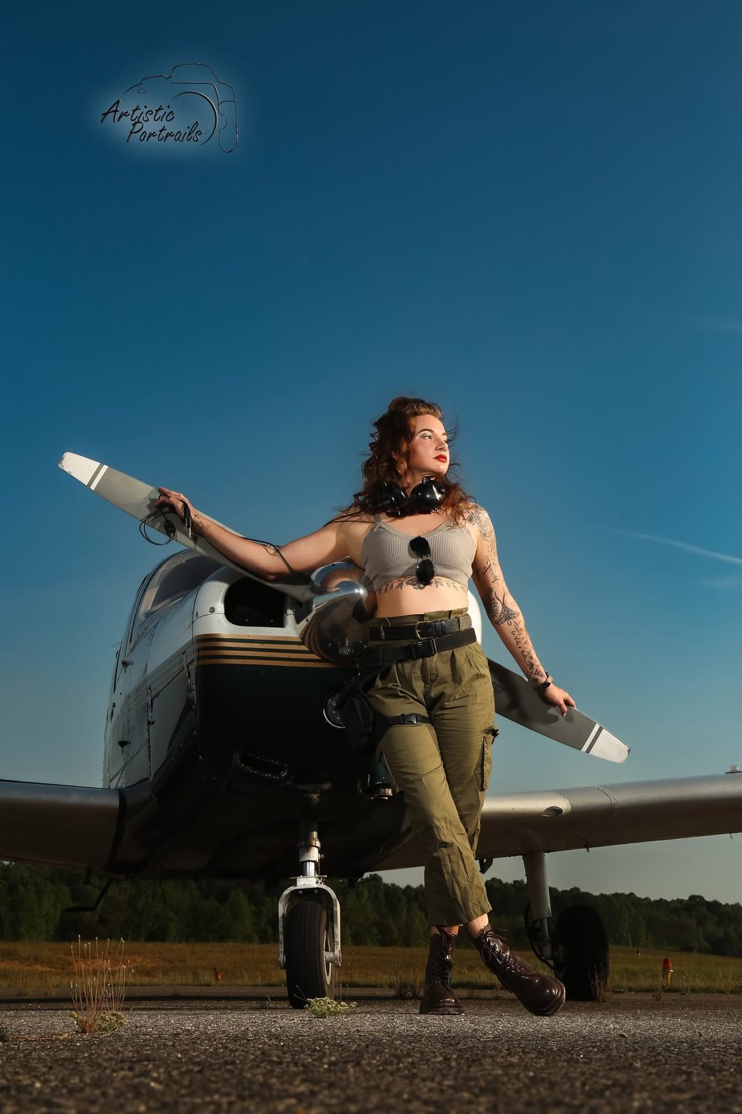 Rachel McFarland standing in front of an airplane on the ramp